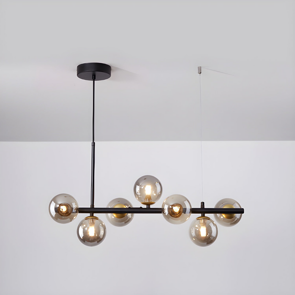 Modern chandelier with adjustable height featuring 11 glass globes and a black metal frame, ideal for living rooms and dining areas. 2