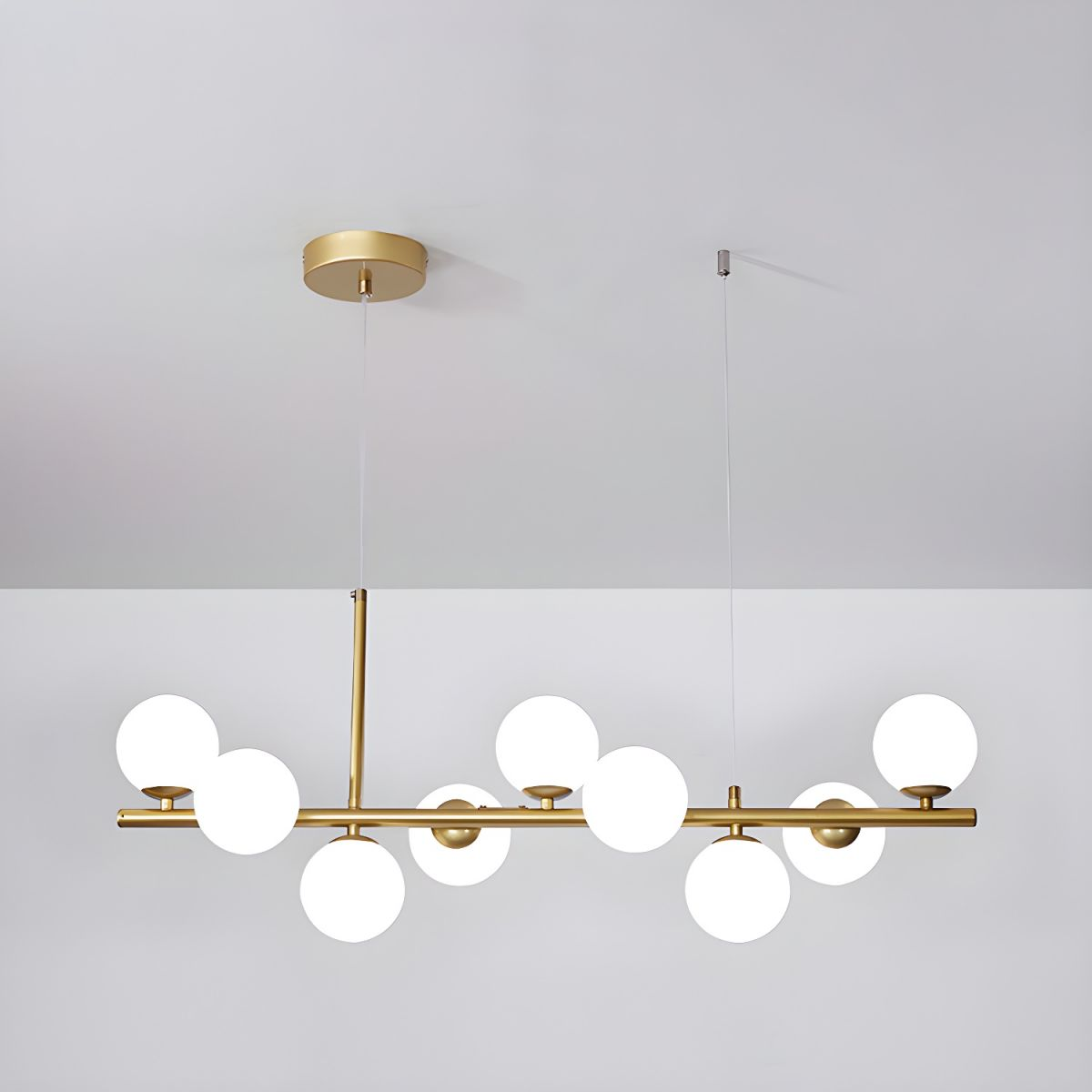 Modern chandelier with adjustable height featuring 11 glass globes and a black metal frame, ideal for living rooms and dining areas. 9