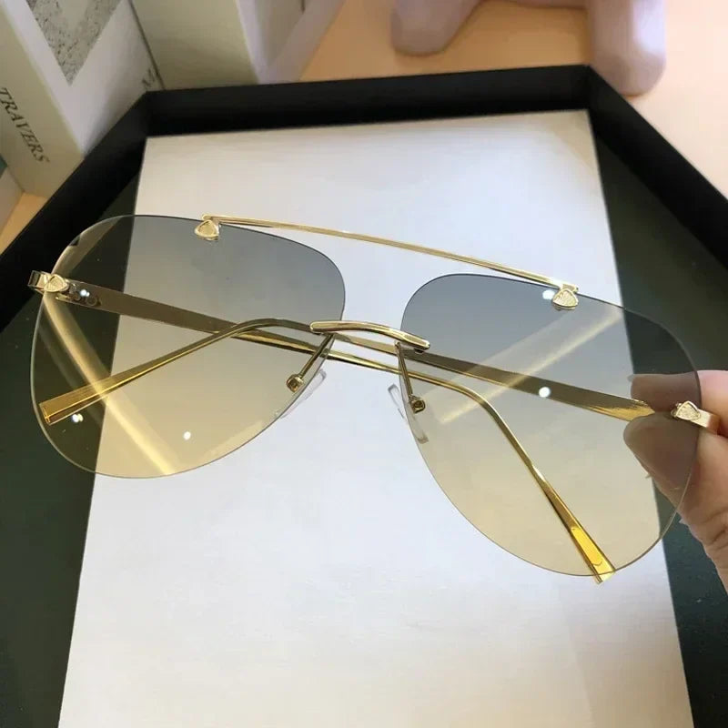 Sluneční brýle aviator bez obrouček, unisex model v černé a hnědé barvě, s gradientními 5
